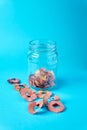 Sharpening shavings on glass isolated on blue background