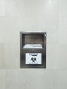 Sharps disposal. Container for disposal of used syringes in a public place.