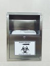 Sharps disposal. Container for disposal of used syringes in a public place.