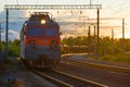 Electric locomotive VL-80C with a freight train at sunset