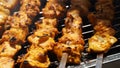 Shashlik - traditional Georgian barbecue. Closeup of raw roasted marinated meat barbecue shish kebab shashlik on steel metal Royalty Free Stock Photo