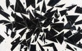 Shattered black glass pieces scattered randomly on a white surface create an abstract art composition Royalty Free Stock Photo