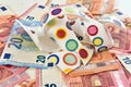 Shattered cup on top of euro bills symbolising economic fallout. Royalty Free Stock Photo