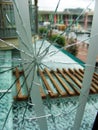 Shattered glass window near a glass roof Royalty Free Stock Photo