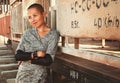 Shaved-headed girl silhouette on the sunset scenery, desert view, train and rails