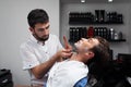 Shaves a customer's neck in Barbershop Royalty Free Stock Photo