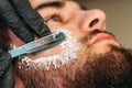 Shaving bearded man face closeup Royalty Free Stock Photo