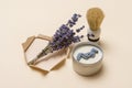 Shaving brush, dried lavender and shaving foam on camel color background. Spa organic foam. Zero waste concept