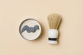 Shaving brush and shaving foam on camel color background. Spa organic foam. Zero waste concept