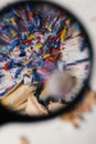 Shaving of colored pencils seen with a magnifying glass with a psychedelic look of colors with distortion of the look, as seen wit Royalty Free Stock Photo