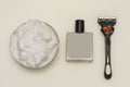 Shaving foam, aftershave with blank label and razor on white background. Top view, branding mockup