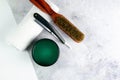 Shaving gel, towel, Comb and dangerous razor stand on a concrete background