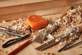 Shaving plane wooden shavings hammer flat chisels construction concept Royalty Free Stock Photo