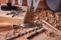 Shaving plane wooden shavings hammer flat chisels construction concept. Royalty Free Stock Photo