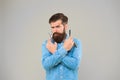 Shaving with a real blade sounds cool. Bearded man prepare shaving tools yellow background. Hipster hold shaving razor Royalty Free Stock Photo