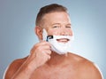 Shaving, smile and portrait with cream and razor for face cleaning, wellness and skincare. Morning grooming, foam and Royalty Free Stock Photo