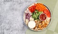 Shawarma Doner Kebab with sauce and flat bread on a round plate on a dark grey background