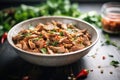 shawarma meat being marinated with spices and herbs in a bowl