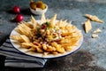 shawarma nachos served in a dish side view isolared on wooden table