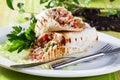 Shawarma in pita bread on a plate small still-life green board restaurant beauty appetizing atmosphere