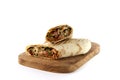 Shawarma, roll in lavash , grilled meat, with vegetables, sandwich , cut on a white background, horizontal, copy spase