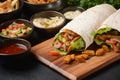 Shawarma Rolled Sandwich with Sauce and vegetables, Arab Traditional Food. Royalty Free Stock Photo