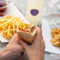 Shawarma sandwich gyro fresh roll of lavash, pita bread chicken beef shawarma falafel Royalty Free Stock Photo