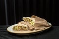 Shawarma sandwich gyro fresh roll of lavash pita bread on white plate Royalty Free Stock Photo