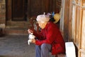 An elderly lady who eats in the village of Shaxi, Yunnan, China