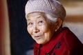 An elderly smiling lady in the village of Shaxi, Yunnan, China