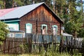 Shchuchinsk, Kazakhstan - July 08, 2021: an old log house in the woods Royalty Free Stock Photo