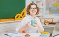 Shcool teacher in class on blackboard background. Professional portrait. Royalty Free Stock Photo