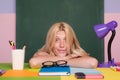 Shcool teacher in class on blackboard background. Professional portrait.