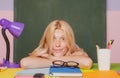 Shcool teacher in class on blackboard background. Professional portrait. Royalty Free Stock Photo