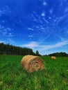 A sheaf of hay in a meadow near the Mi?om?yn municipal bathing area. Royalty Free Stock Photo