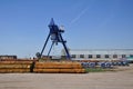 Shear legs crane at the storage yard for steel