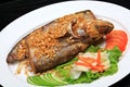 Sheatfishes Fish Fried with crispy garlic on a white plate Royalty Free Stock Photo