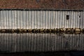 Shed reflection over water