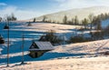 Shed on snow covered agricultural hillside