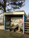 Shed with wheelbarrows, utility carts, hose and fire extinguisher Royalty Free Stock Photo