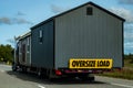 Sheds as oversize load on semi transport truck Royalty Free Stock Photo