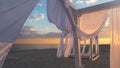 Sheds awning with fabric white curtains on the seashore breeze in the wind Royalty Free Stock Photo