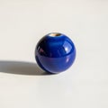 Sheen and reflections on the bead\'s surface emphasize its smooth texture Royalty Free Stock Photo