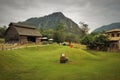 Sheep farm that is surrounded by mountains.