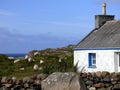 Sheep Graze Beside a Crofter`s Cottage on the Atlantic Coast of Royalty Free Stock Photo