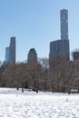 Sheep Meadow Covered in Snow at Central Park in New York City with the Midtown Manhattan Skyline during Winter Royalty Free Stock Photo