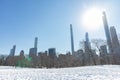 Sheep Meadow Covered in Snow at Central Park in New York City with the Midtown Manhattan Skyline during Winter Royalty Free Stock Photo