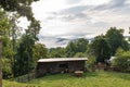 Sheep pen barn and corral with a misty mountain scene beyond, bucolic farm scene
