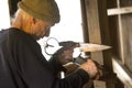 Sheep shearer sharpening blades of his steel shears