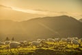 sheeps eating grass in the mountains at sunset Royalty Free Stock Photo